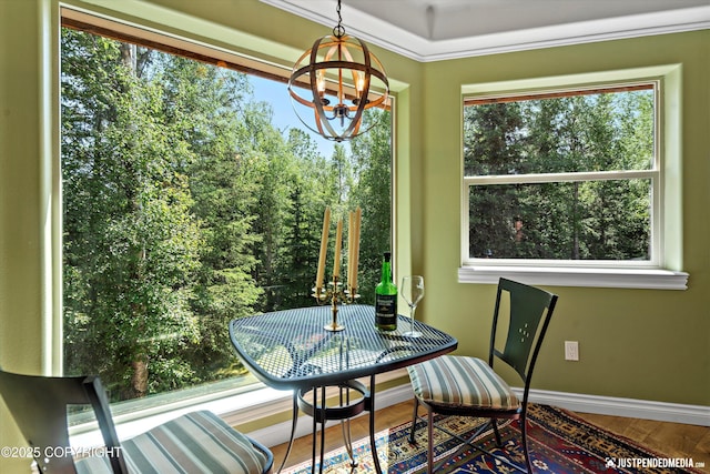 2215 S Austin Cir, Palmer, AK 99645 - dining room featuring a chandelier, wood finished floors, and plenty of natural light
