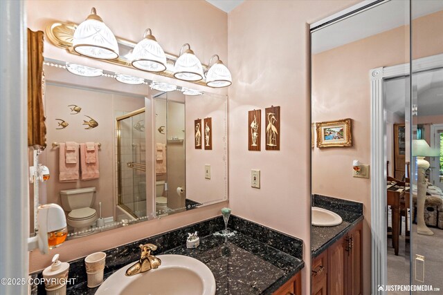 2215 S Austin Cir, Palmer, AK 99645 - bathroom featuring a shower with door and vanity