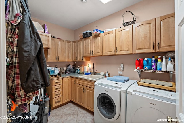 2215 S Austin Cir, Palmer, AK 99645 - laundry area with washing machine and clothes dryer, cabinet space, and light tile patterned floors