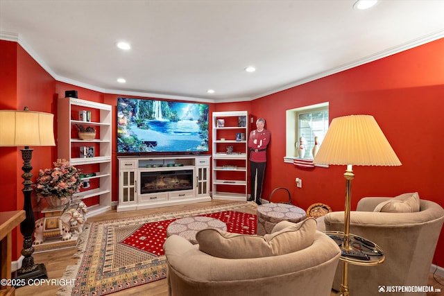 2215 S Austin Cir, Palmer, AK 99645 - living area with crown molding, recessed lighting, wood finished floors, and a glass covered fireplace