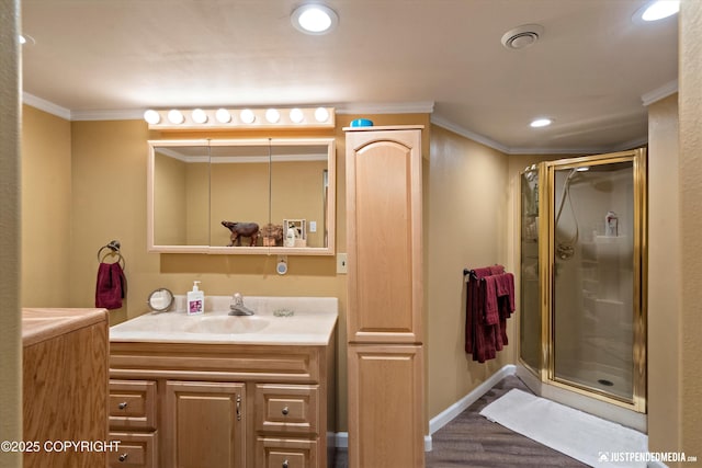 2215 S Austin Cir, Palmer, AK 99645 - full bath featuring ornamental molding, vanity, a stall shower, wood finished floors, and recessed lighting