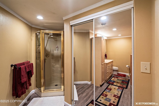 2215 S Austin Cir, Palmer, AK 99645 - bathroom featuring ornamental molding, a stall shower, recessed lighting, vanity, and wood finished floors