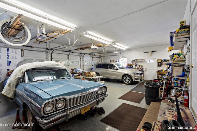 2215 S Austin Cir, Palmer, AK 99645 - garage featuring a garage door opener