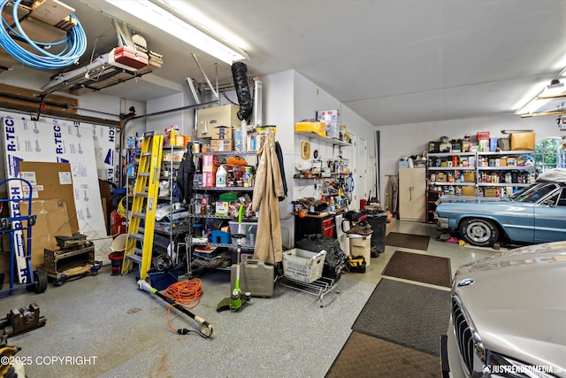 2215 S Austin Cir, Palmer, AK 99645 - garage with a garage door opener and a workshop area