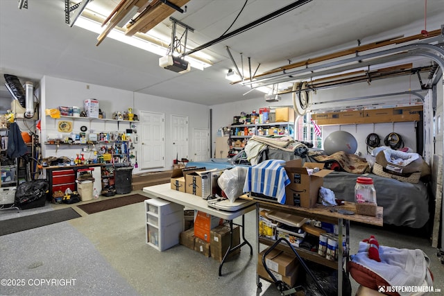 2215 S Austin Cir, Palmer, AK 99645 - garage featuring a workshop area and a garage door opener