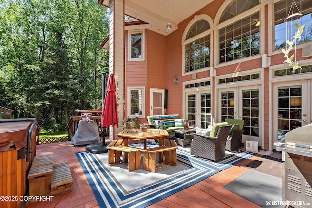 2215 S Austin Cir, Palmer, AK 99645 - wooden deck featuring a hot tub, an outdoor hangout area, grilling area, and french doors