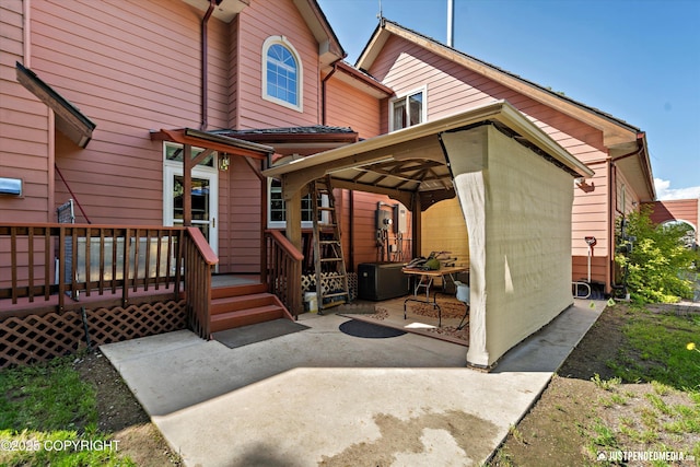 2215 S Austin Cir, Palmer, AK 99645 - rear view of house featuring a deck, a gazebo, and a patio