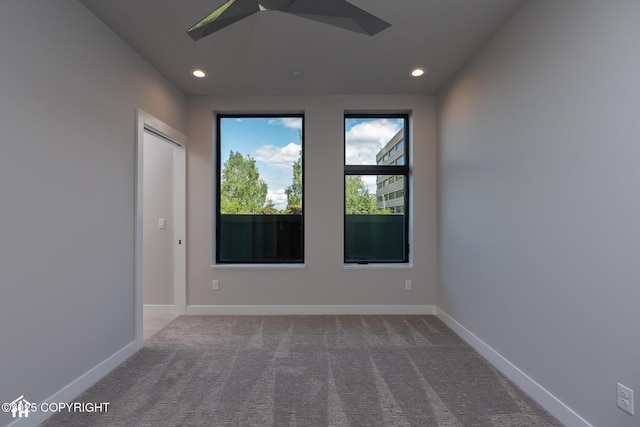 528 Coastal Pl # 1, Anchorage, AK 99501 - empty room with carpet flooring, recessed lighting, baseboards, and a skylight