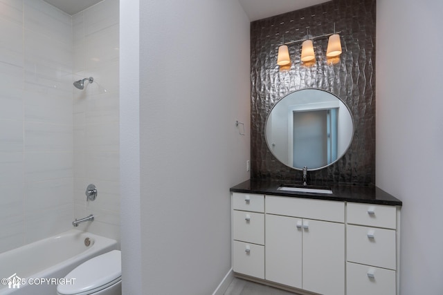 528 Coastal Pl # 1, Anchorage, AK 99501 - bathroom with vanity, washtub / shower combination, and toilet