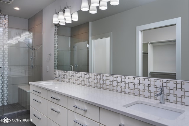528 Coastal Pl # 1, Anchorage, AK 99501 - bathroom with decorative backsplash, a shower stall, double vanity, and recessed lighting
