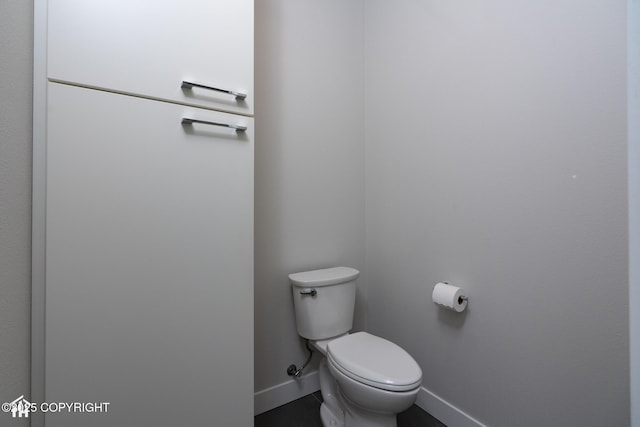 528 Coastal Pl # 1, Anchorage, AK 99501 - bathroom with baseboards and toilet