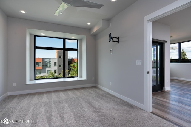 528 Coastal Pl # 1, Anchorage, AK 99501 - unfurnished room with ceiling fan, baseboards, recessed lighting, and carpet floors