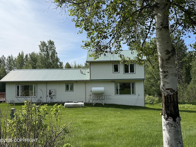 9810 N Runyon Cir, Palmer, AK 99645 - rear view of property featuring a lawn and a metal roof