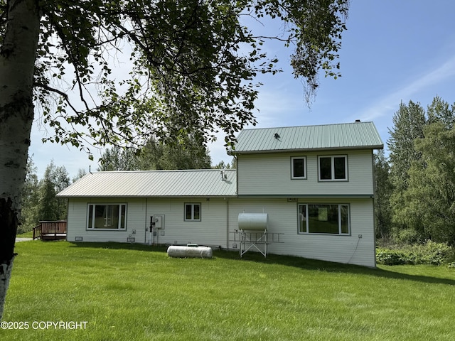 9810 N Runyon Cir, Palmer, AK 99645 - rear view of property featuring a yard, a metal roof, and a wooden deck