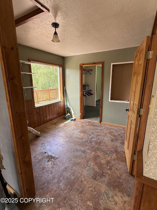 9810 N Runyon Cir, Palmer, AK 99645 - spare room featuring a textured ceiling