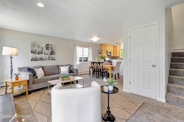6831 Cheryl St, Anchorage, AK 99518 - living room with stairs, a baseboard radiator, light colored carpet, recessed lighting, and baseboards
