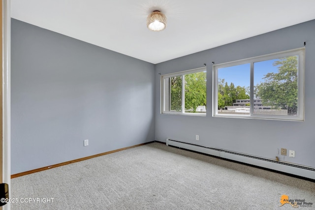 3135 Delta Dr, Anchorage, AK 99502 - unfurnished room with a baseboard heating unit, baseboards, and carpet flooring