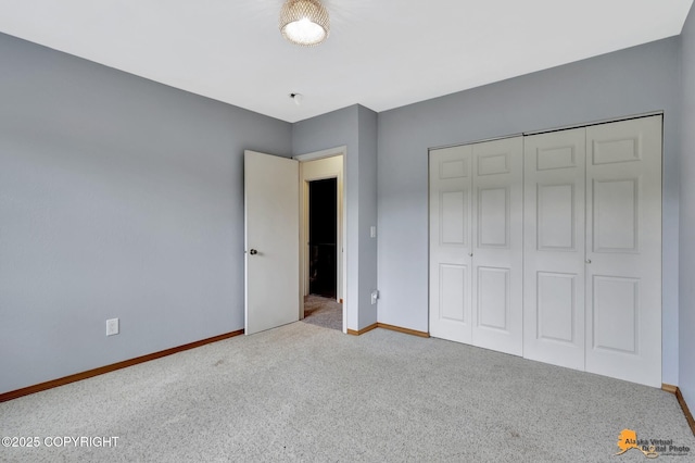 3135 Delta Dr, Anchorage, AK 99502 - unfurnished bedroom featuring carpet flooring, baseboards, and a closet