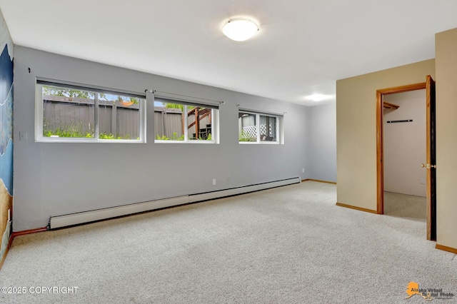 3135 Delta Dr, Anchorage, AK 99502 - empty room featuring a baseboard radiator, carpet flooring, and baseboards