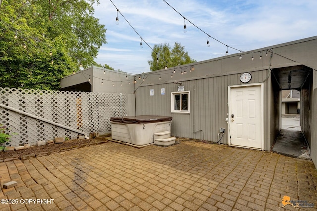 3135 Delta Dr, Anchorage, AK 99502 - view of patio / terrace with a hot tub