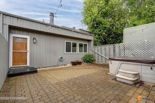3135 Delta Dr, Anchorage, AK 99502 - view of patio featuring a hot tub