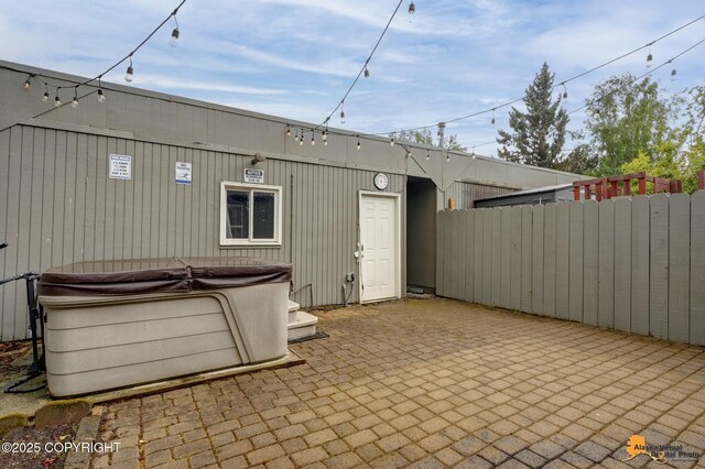 3135 Delta Dr, Anchorage, AK 99502 - view of patio featuring a hot tub