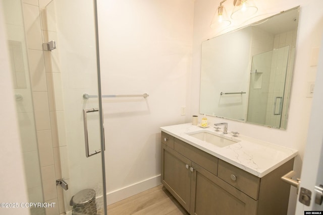 101 Jeff Davis St, Sitka, AK 99835 - bathroom featuring a stall shower, vanity, baseboards, and wood finished floors