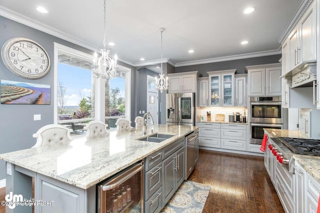 5044 E Loft Cir, Wasilla, AK 99654 - kitchen featuring stainless steel appliances, a sink, beverage cooler, a chandelier, and recessed lighting