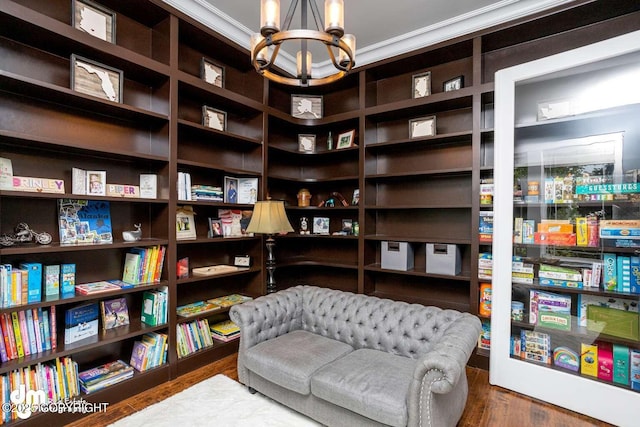 5044 E Loft Cir, Wasilla, AK 99654 - living area featuring a chandelier, wood finished floors, and crown molding