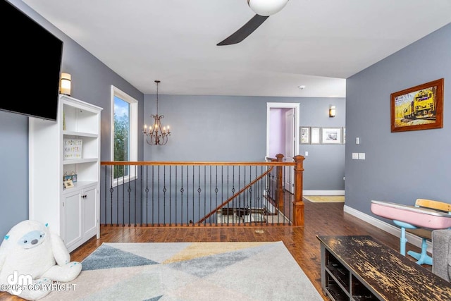 5044 E Loft Cir, Wasilla, AK 99654 - dining room with a chandelier, wood finished floors, baseboards, and ceiling fan