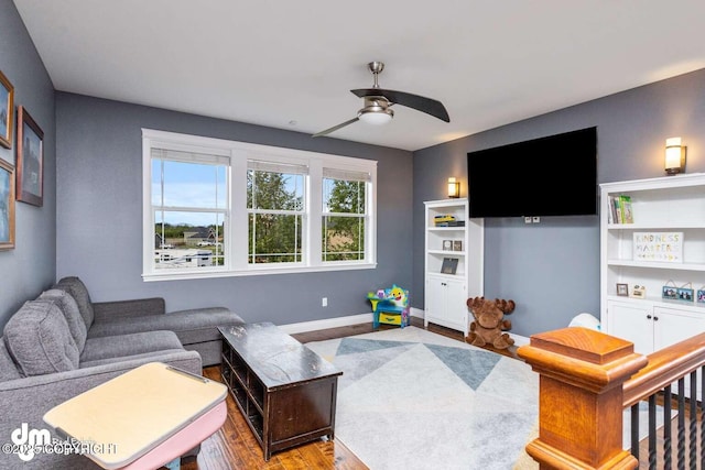5044 E Loft Cir, Wasilla, AK 99654 - living room with a ceiling fan, baseboards, and wood finished floors