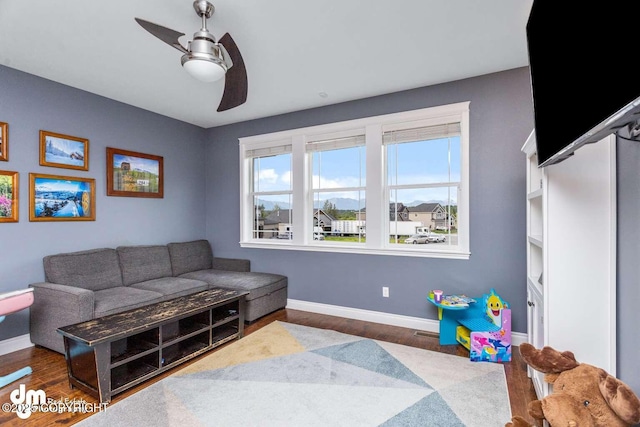 5044 E Loft Cir, Wasilla, AK 99654 - living area featuring ceiling fan, baseboards, and wood finished floors