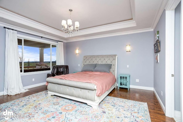 5044 E Loft Cir, Wasilla, AK 99654 - bedroom with a chandelier, crown molding, a tray ceiling, wood finished floors, and baseboards
