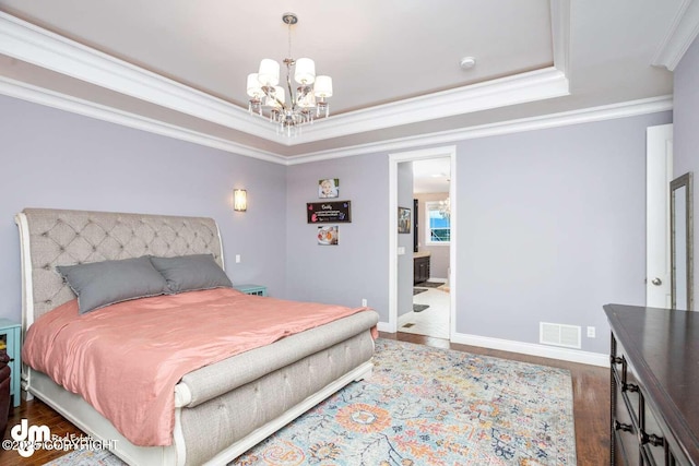 5044 E Loft Cir, Wasilla, AK 99654 - bedroom with a chandelier, ornamental molding, a raised ceiling, wood finished floors, and baseboards