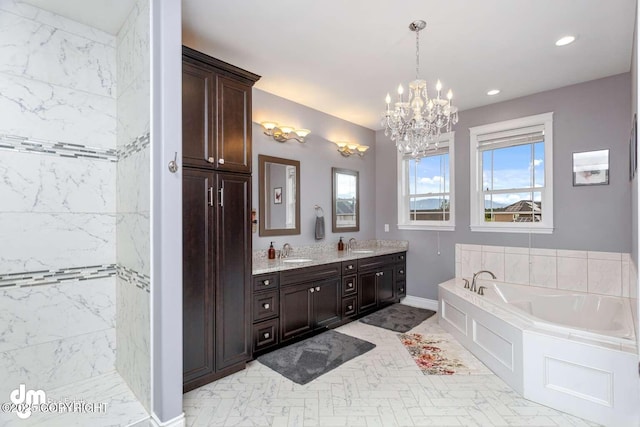 5044 E Loft Cir, Wasilla, AK 99654 - bathroom featuring a bath, double vanity, a chandelier, recessed lighting, and baseboards