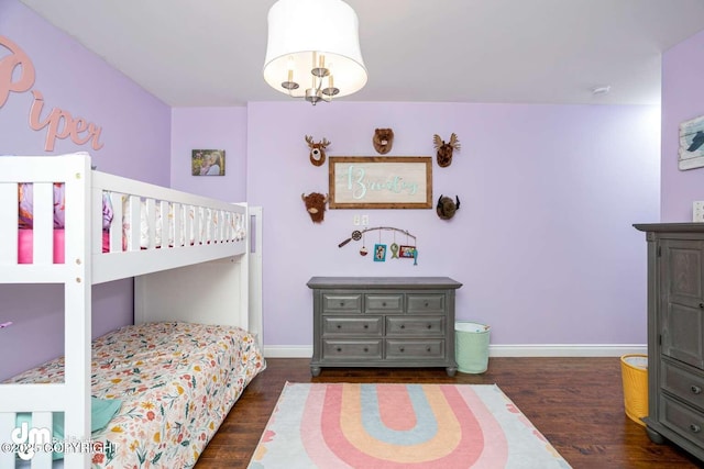 5044 E Loft Cir, Wasilla, AK 99654 - bedroom featuring baseboards and wood finished floors