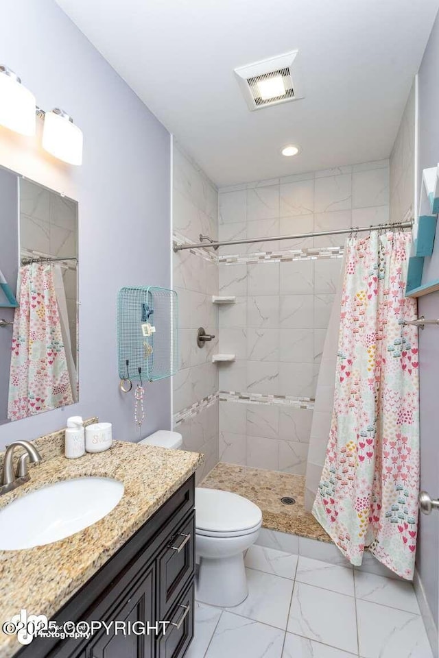 5044 E Loft Cir, Wasilla, AK 99654 - full bathroom featuring vanity, toilet, marble look tile flooring, a shower stall, and recessed lighting
