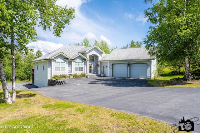 3474 E Wanamingo Dr, Wasilla, AK 99654 - view of front facade featuring a garage and asphalt driveway