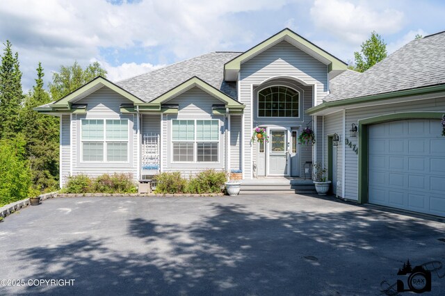 3474 E Wanamingo Dr, Wasilla, AK 99654 - view of front of property featuring asphalt driveway, roof with shingles, and an attached garage