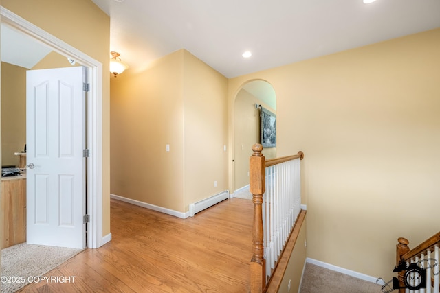 3474 E Wanamingo Dr, Wasilla, AK 99654 - hallway featuring an upstairs landing, a baseboard radiator, light wood-type flooring, and recessed lighting