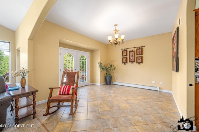 3474 E Wanamingo Dr, Wasilla, AK 99654 - living area featuring baseboard heating, arched walkways, french doors, and a chandelier