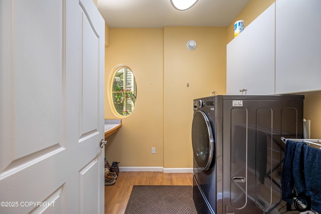 3474 E Wanamingo Dr, Wasilla, AK 99654 - washroom with cabinet space, washer / dryer, and wood finished floors