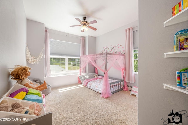 3474 E Wanamingo Dr, Wasilla, AK 99654 - carpeted bedroom with a baseboard heating unit, a ceiling fan, and a textured wall