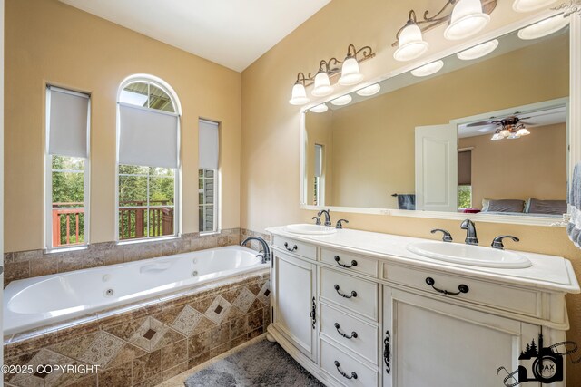 3474 E Wanamingo Dr, Wasilla, AK 99654 - bathroom with a whirlpool tub, double vanity, and a ceiling fan