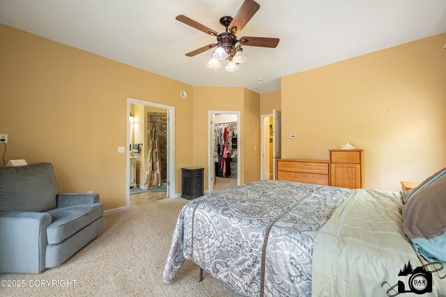 3474 E Wanamingo Dr, Wasilla, AK 99654 - bedroom featuring light colored carpet, a spacious closet, ceiling fan, and ensuite bathroom