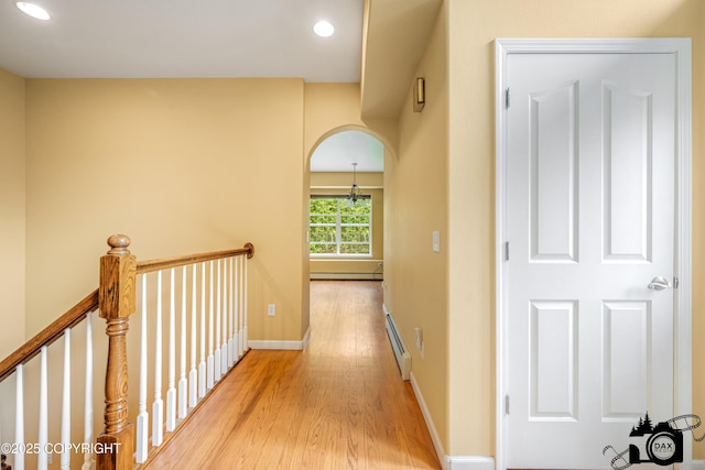 3474 E Wanamingo Dr, Wasilla, AK 99654 - hall featuring light wood-type flooring, a baseboard radiator, recessed lighting, and a baseboard heating unit