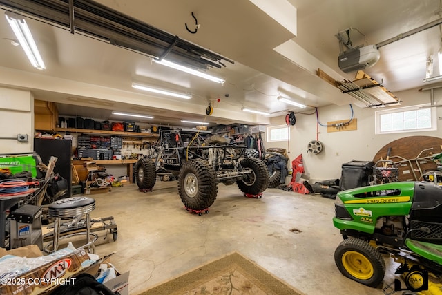 3474 E Wanamingo Dr, Wasilla, AK 99654 - garage featuring a garage door opener and a workshop area