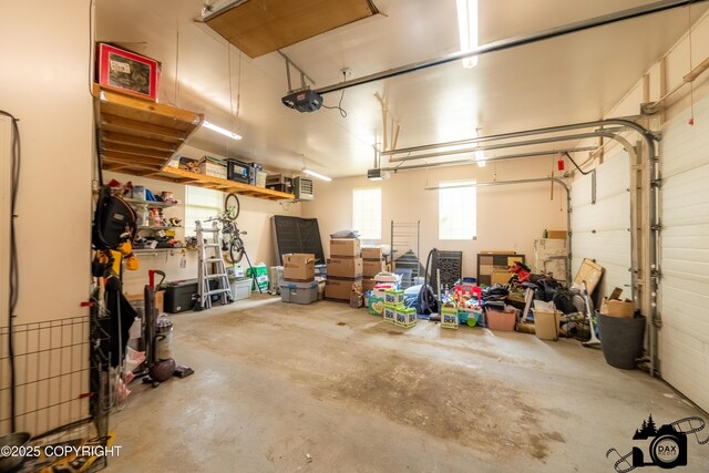 3474 E Wanamingo Dr, Wasilla, AK 99654 - garage featuring a garage door opener