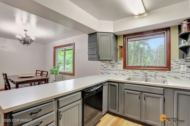 910 S Iris Cir, Palmer, AK 99645 - kitchen featuring black dishwasher, a peninsula, a sink, gray cabinets, and light countertops