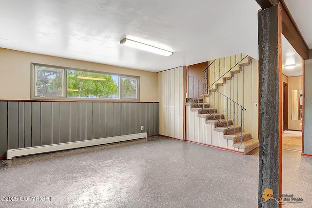 910 S Iris Cir, Palmer, AK 99645 - below grade area featuring a baseboard radiator and stairway
